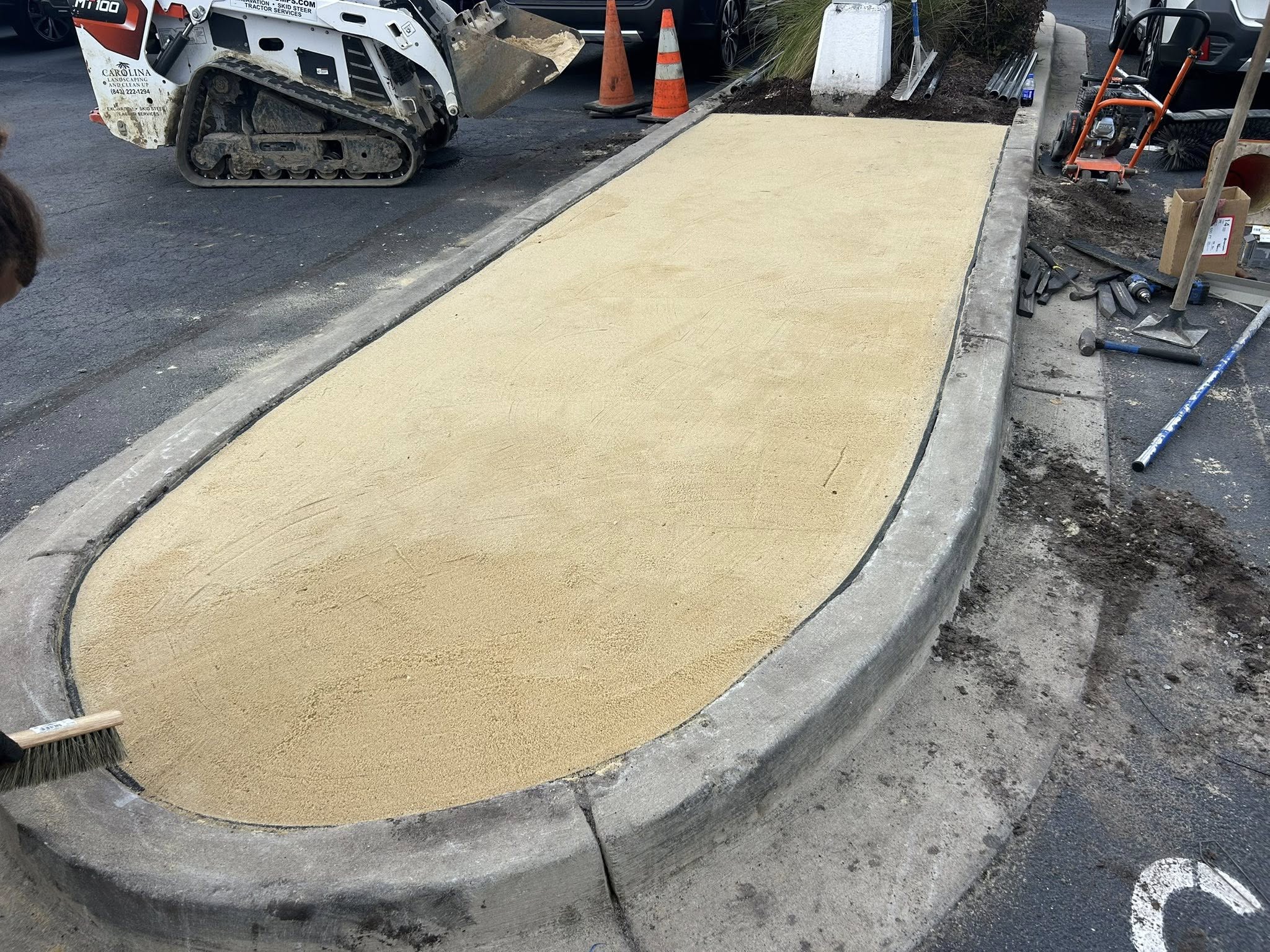 Removed shrubs, and installed artificial turf for dealership