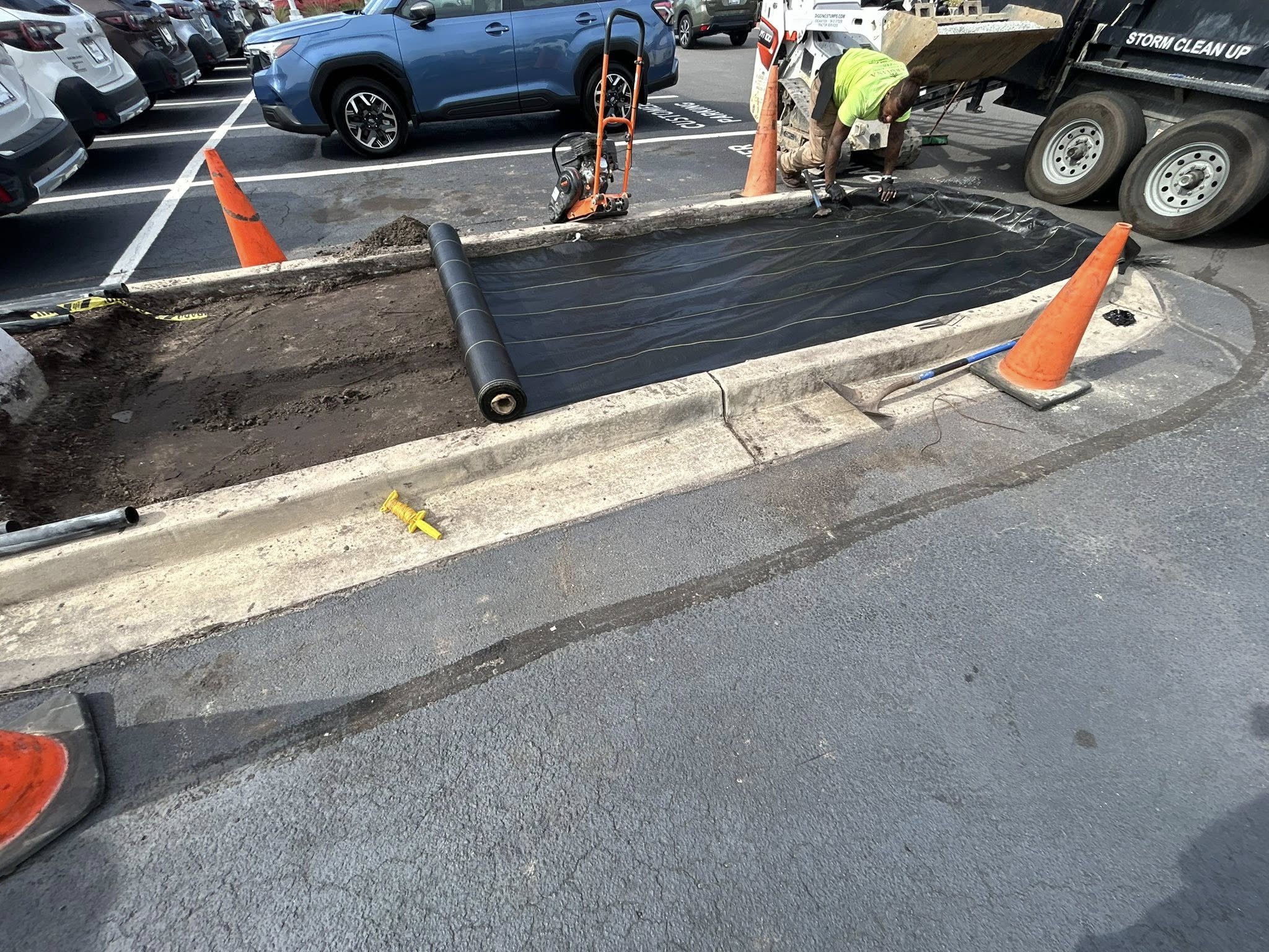 Removed shrubs, and installed artificial turf for dealership