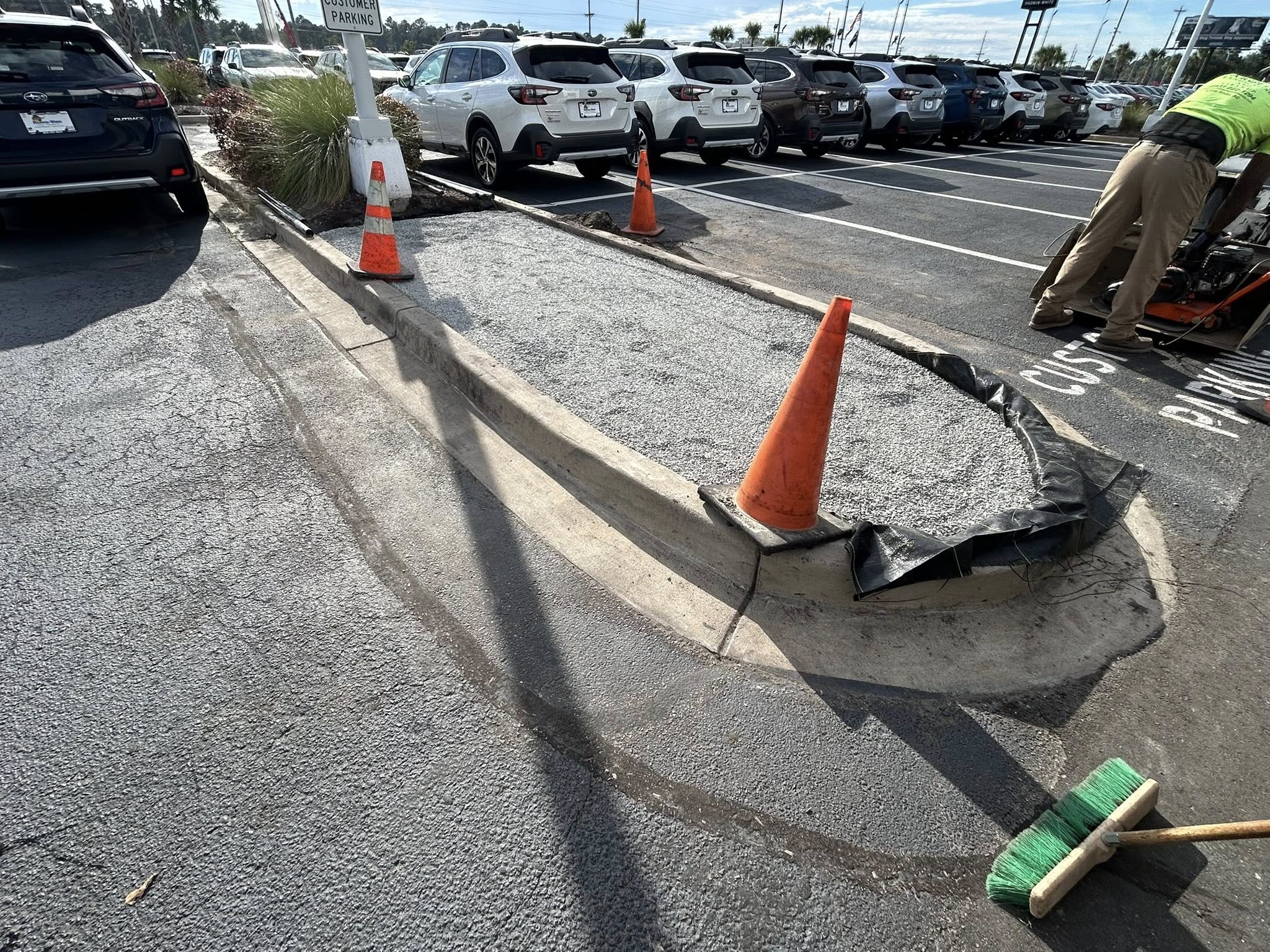 Removed shrubs, and installed artificial turf for dealership