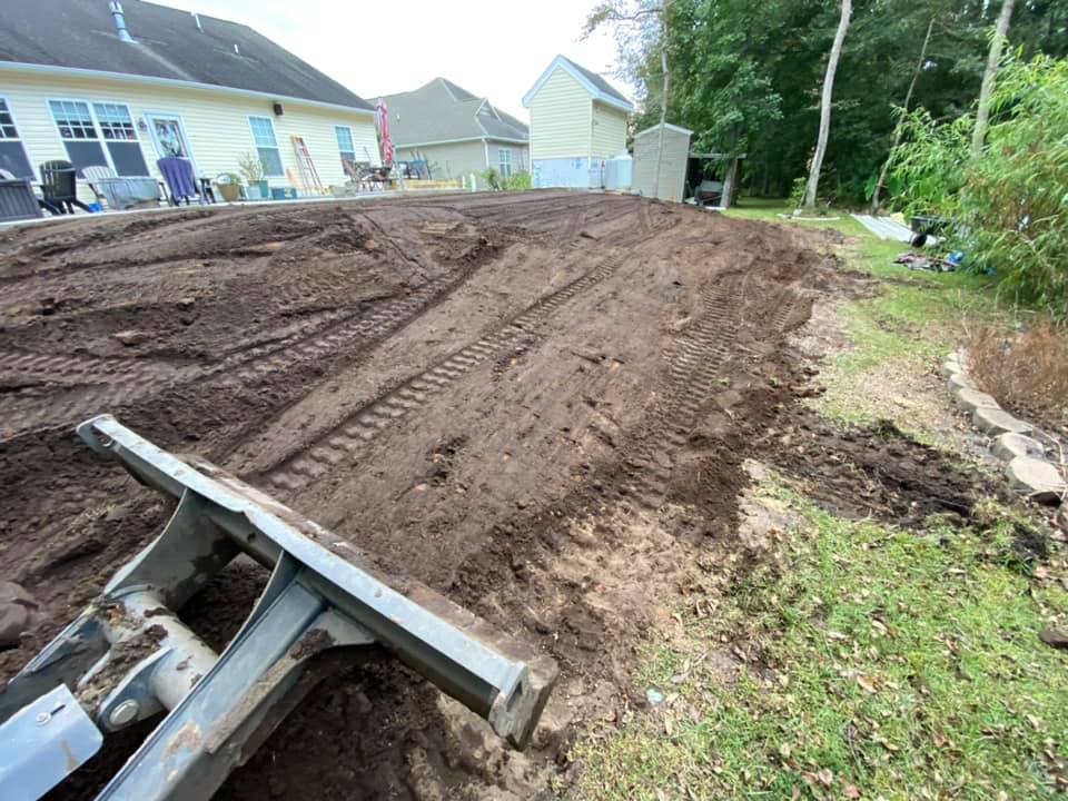 Brought in 5 dump truck loads of fill to prep for sod in Little River, SC 29566