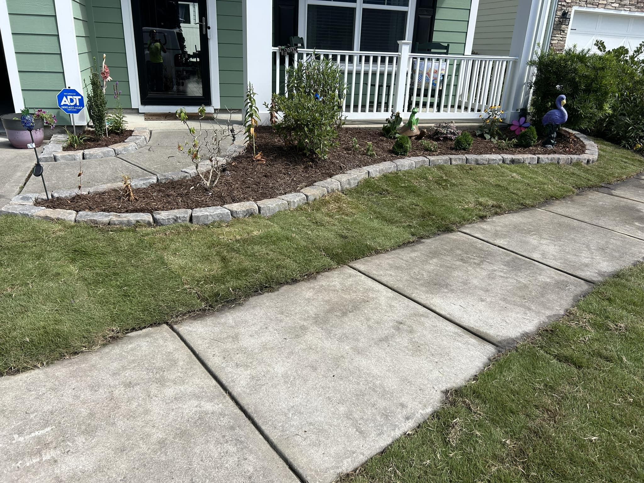 Removed old grass, added soil and installed Emerald Green Zoysia sod down in North Myrtle Beach,SC 29582