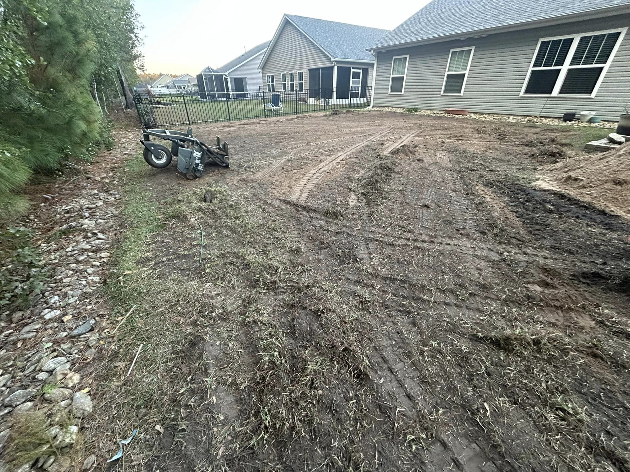 Removed old grass, added soil and installed Centipede, drainage and removed 2 trees in Longs,SC 29568