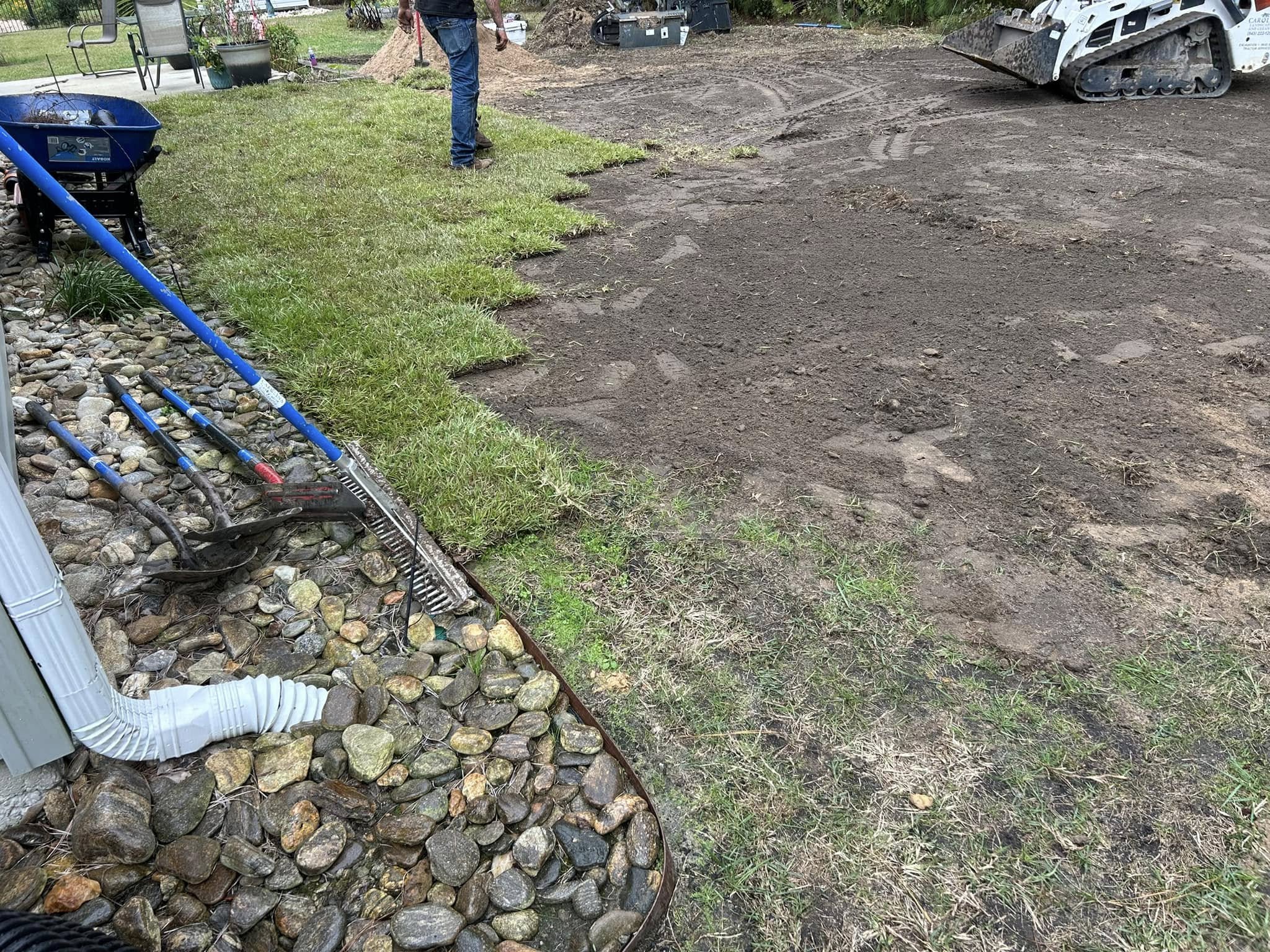 Removed old grass, added soil and installed Centipede, drainage and removed 2 trees in Longs,SC 29568