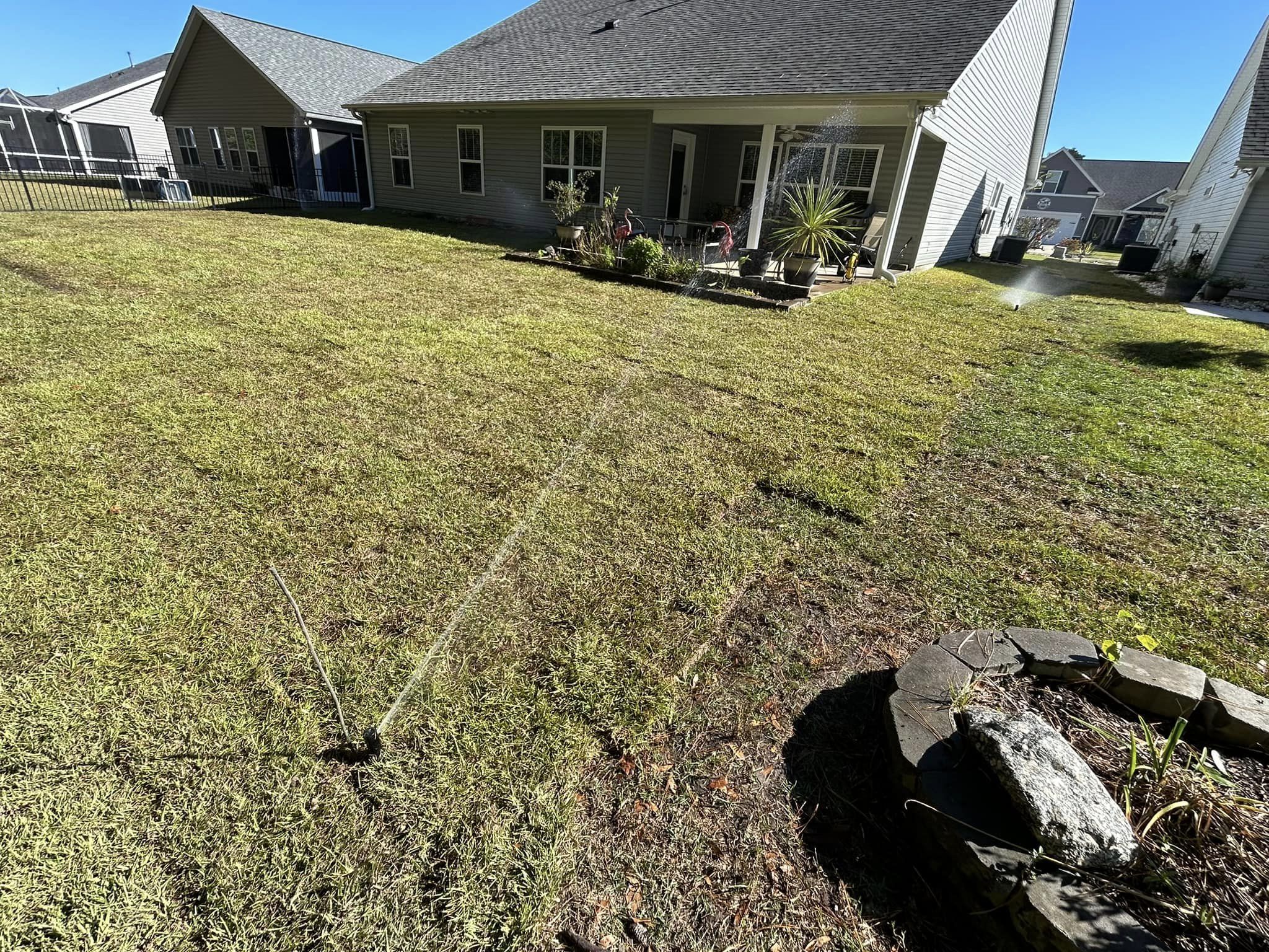 Removed old grass, added soil and installed Centipede, drainage and removed 2 trees in Longs,SC 29568