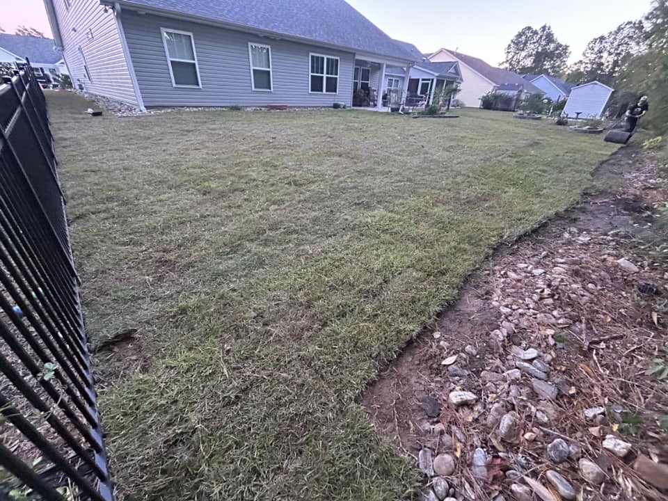 Removed old grass, added soil and installed Centipede, drainage and removed 2 trees in Longs,SC 29568