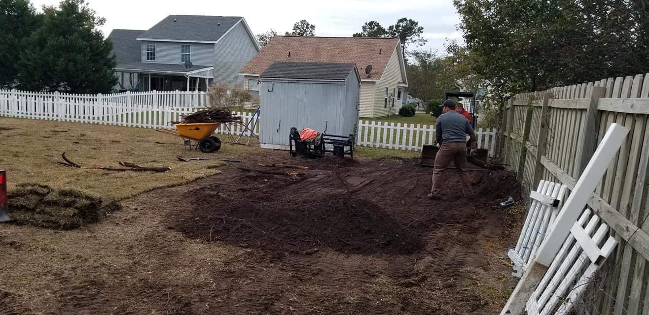 removed trees stump ground graded and put sod down